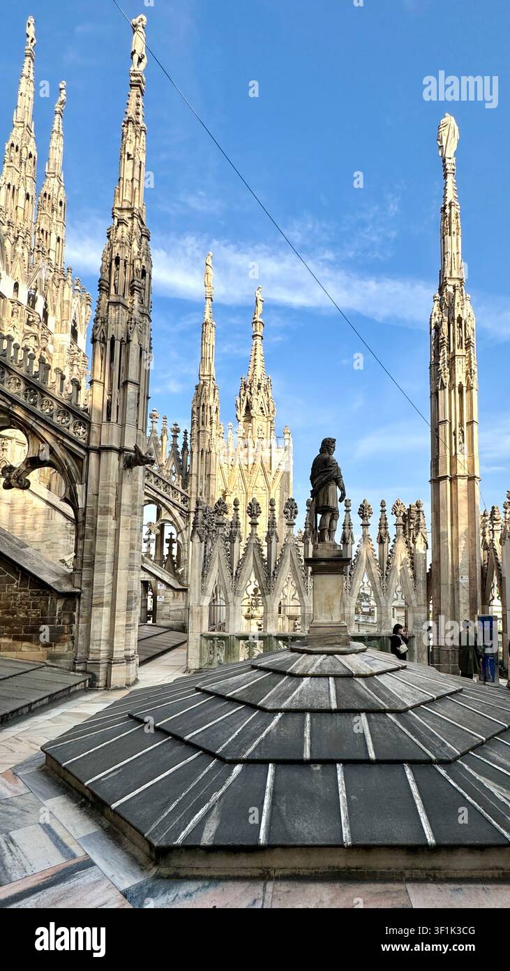 Statues on pinnacles and spires on the roof of the Duomo Cathedral of Milan Lombardy Italy - Smartphone Captured Stock Image