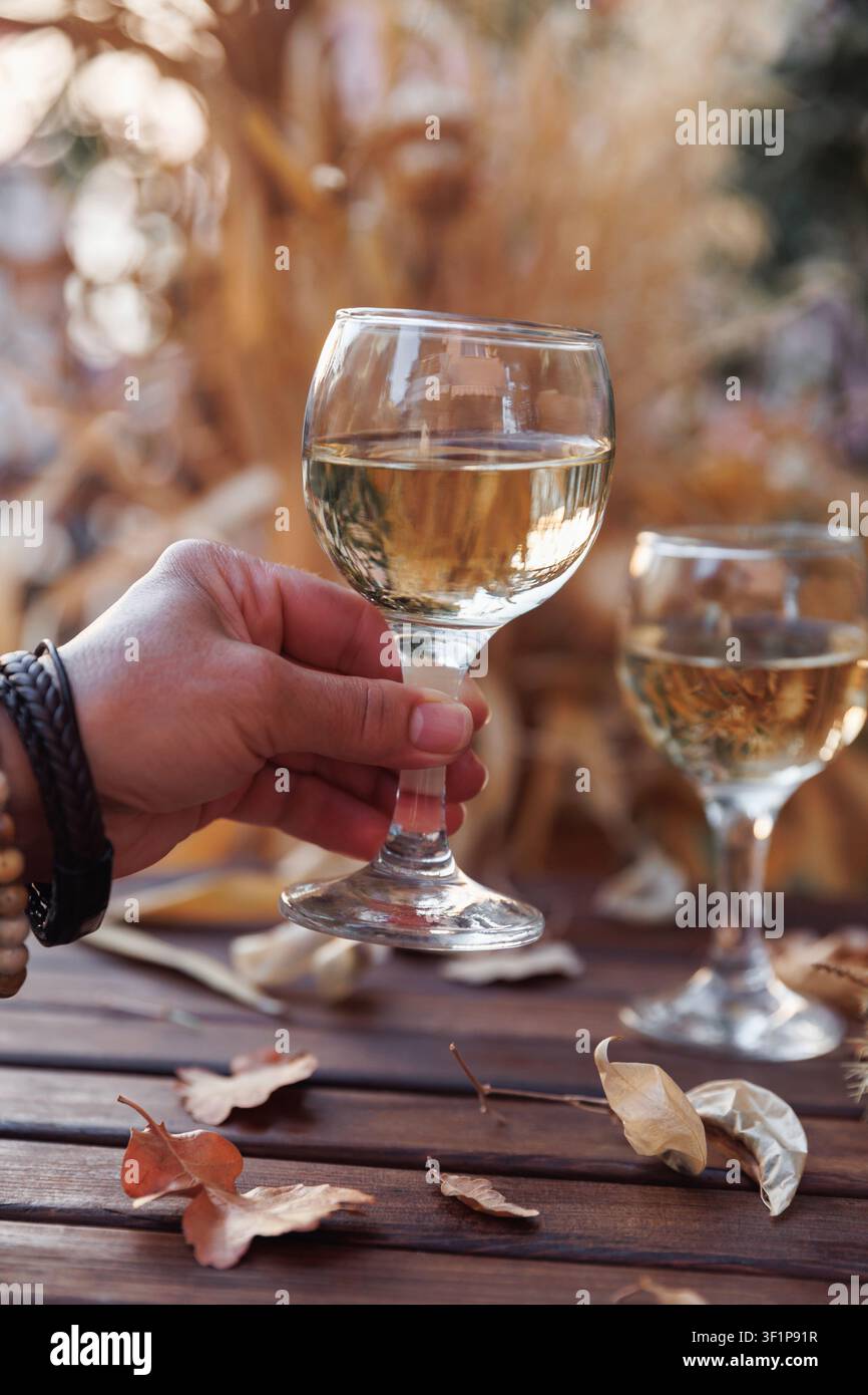 Romantic White Wine Moment on Rustic Autumn Table Stock Photo