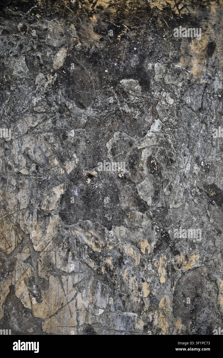 Dark weathered plaster wall texture with distressed aged surface backgrounds Stock Photo