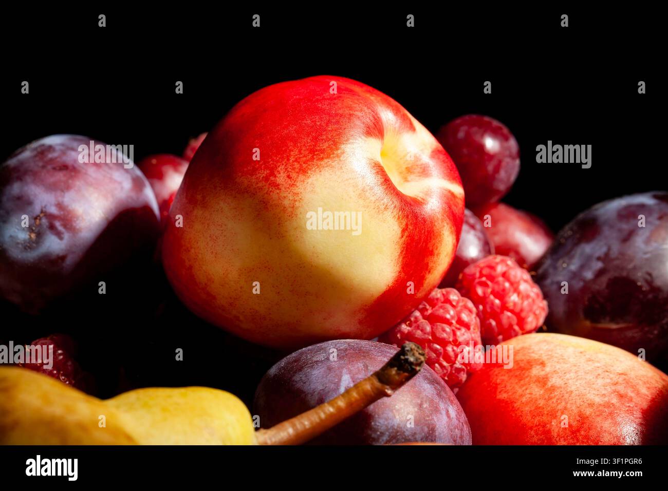 white nectarine fruit mix on black background Stock Photo