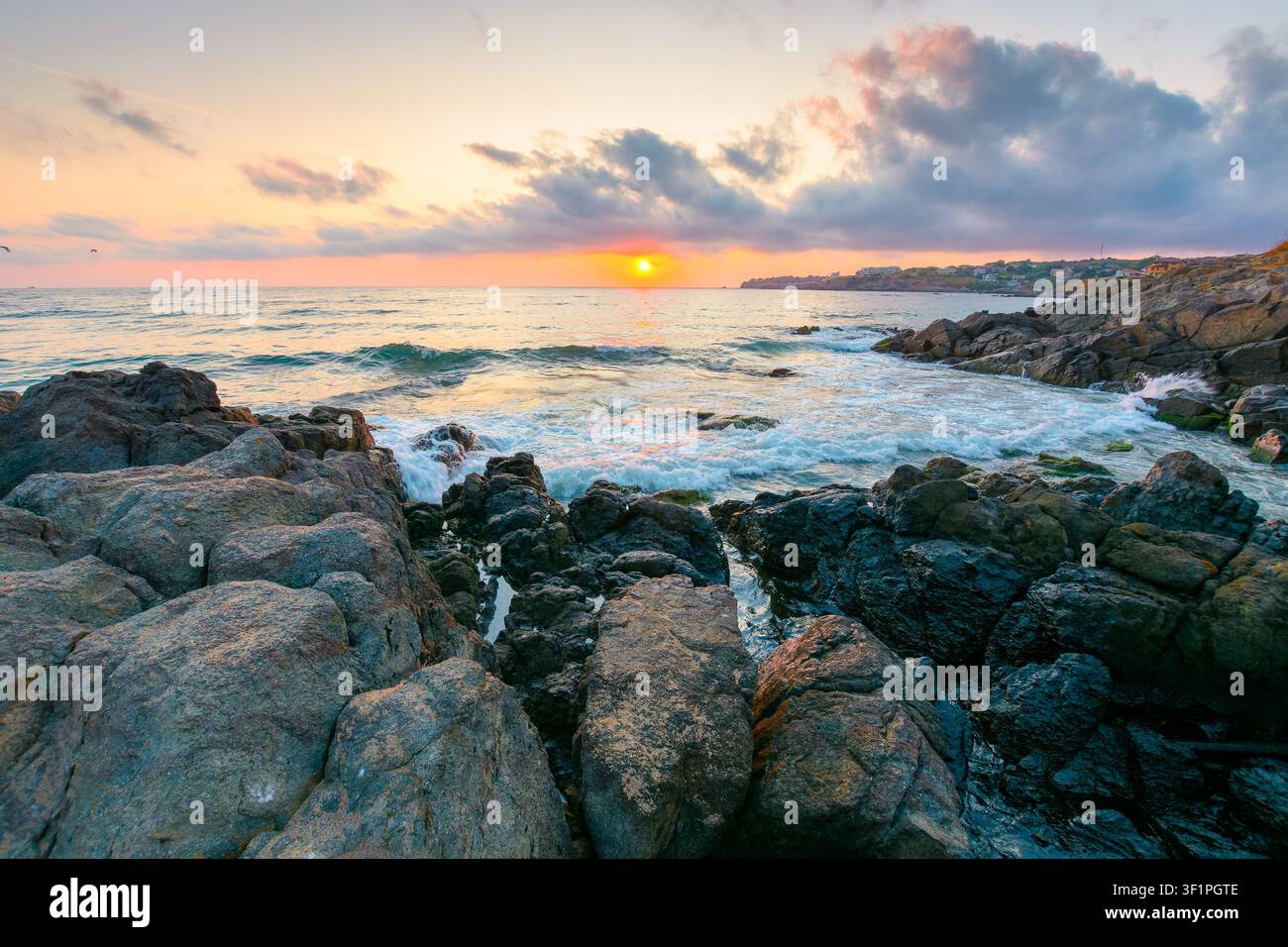 sea landscape at sunrise. rocky coast of bulgaria in summer. dramatic travel background with epic sky Stock Photo