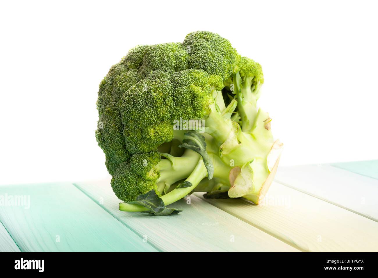 broccoli on wood background on white Stock Photo