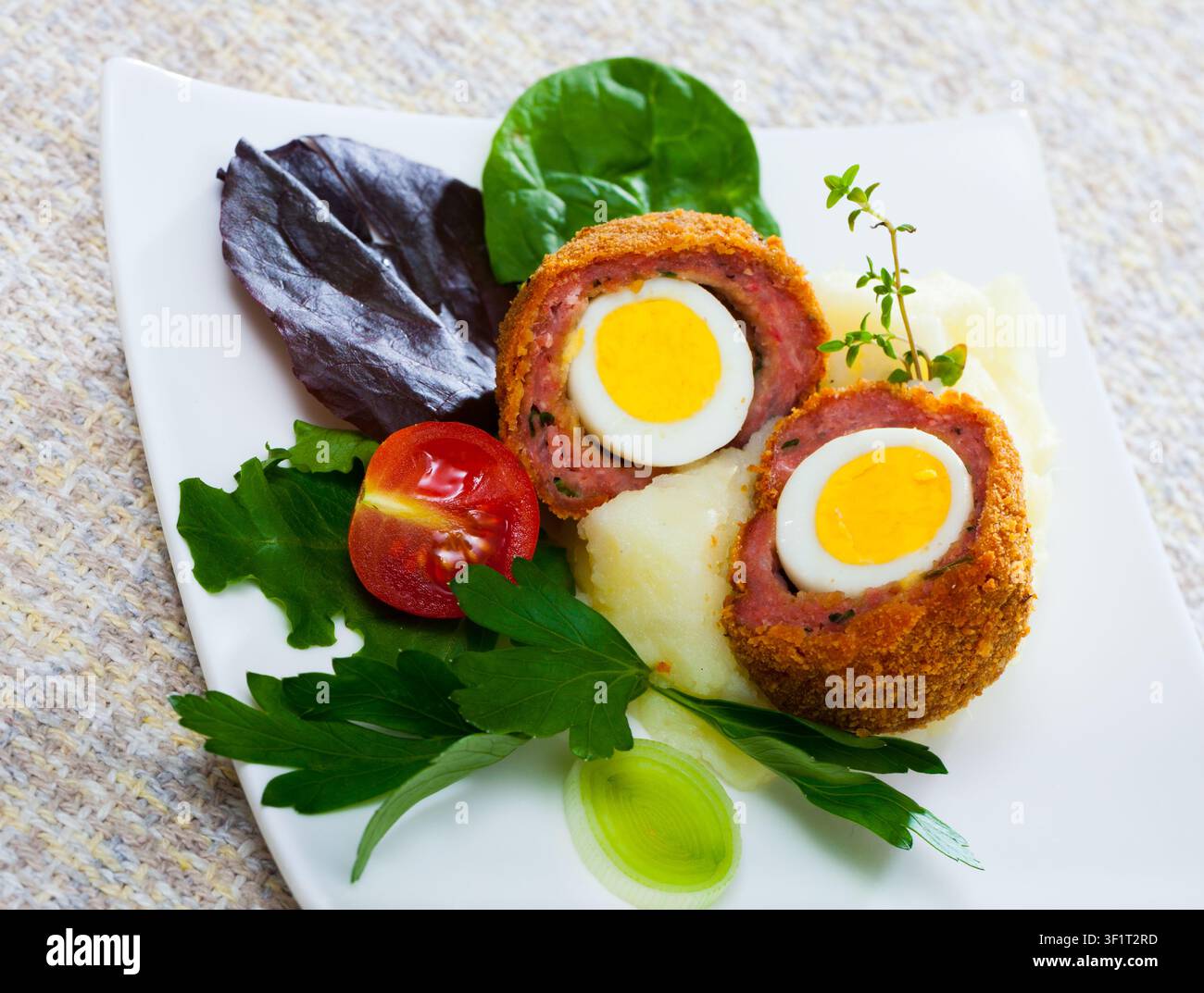 Scotch eggs with vegetables Stock Photo