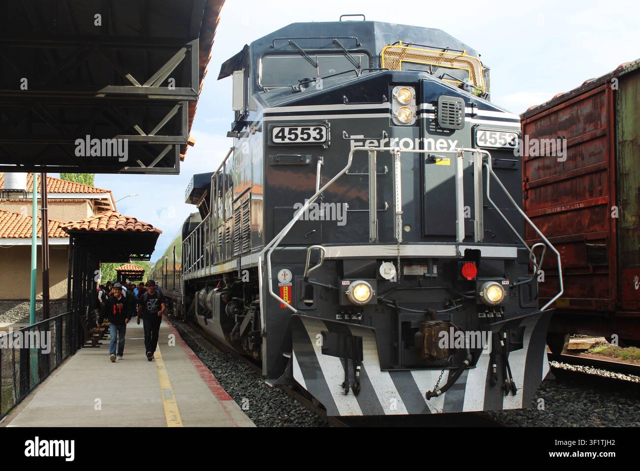 Passengers walking beside train hi-res stock photography and images - Alamy