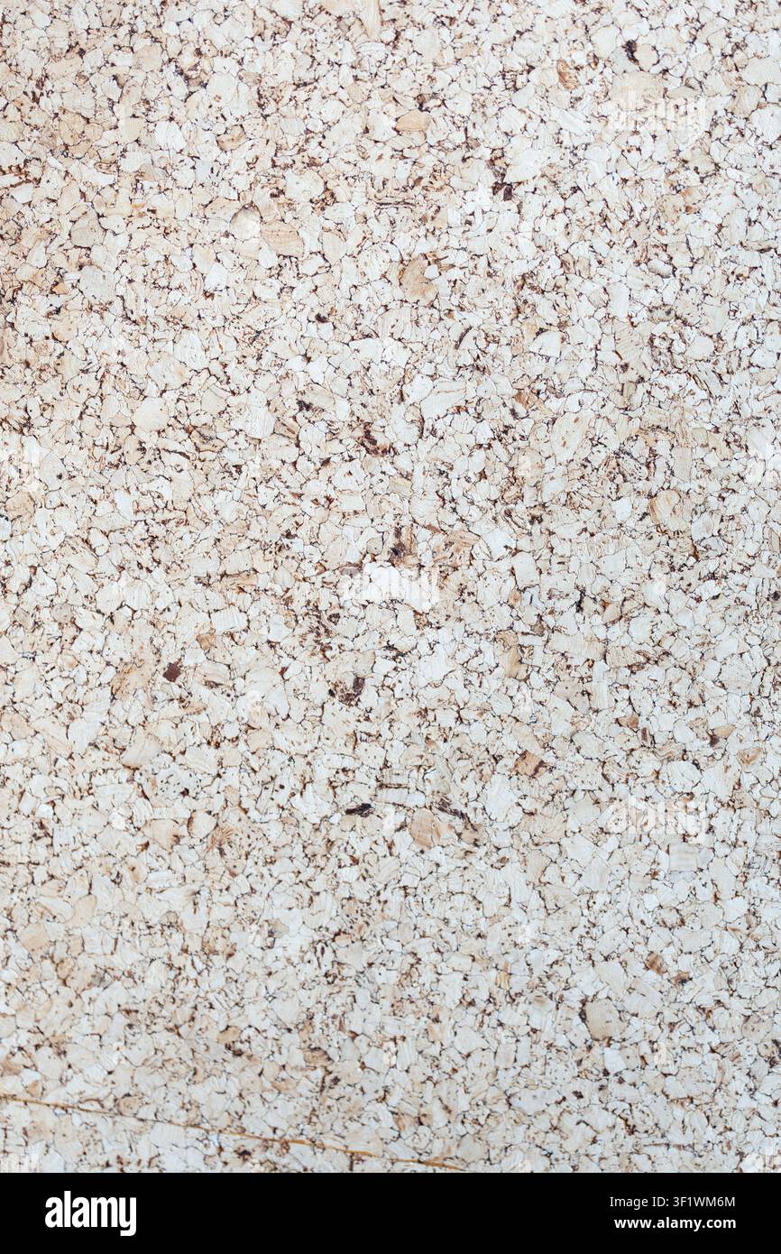 Light Brown corkboard texture with an empty pinboard surface provides a versatile backdrop presentation concepts. Stock Photo