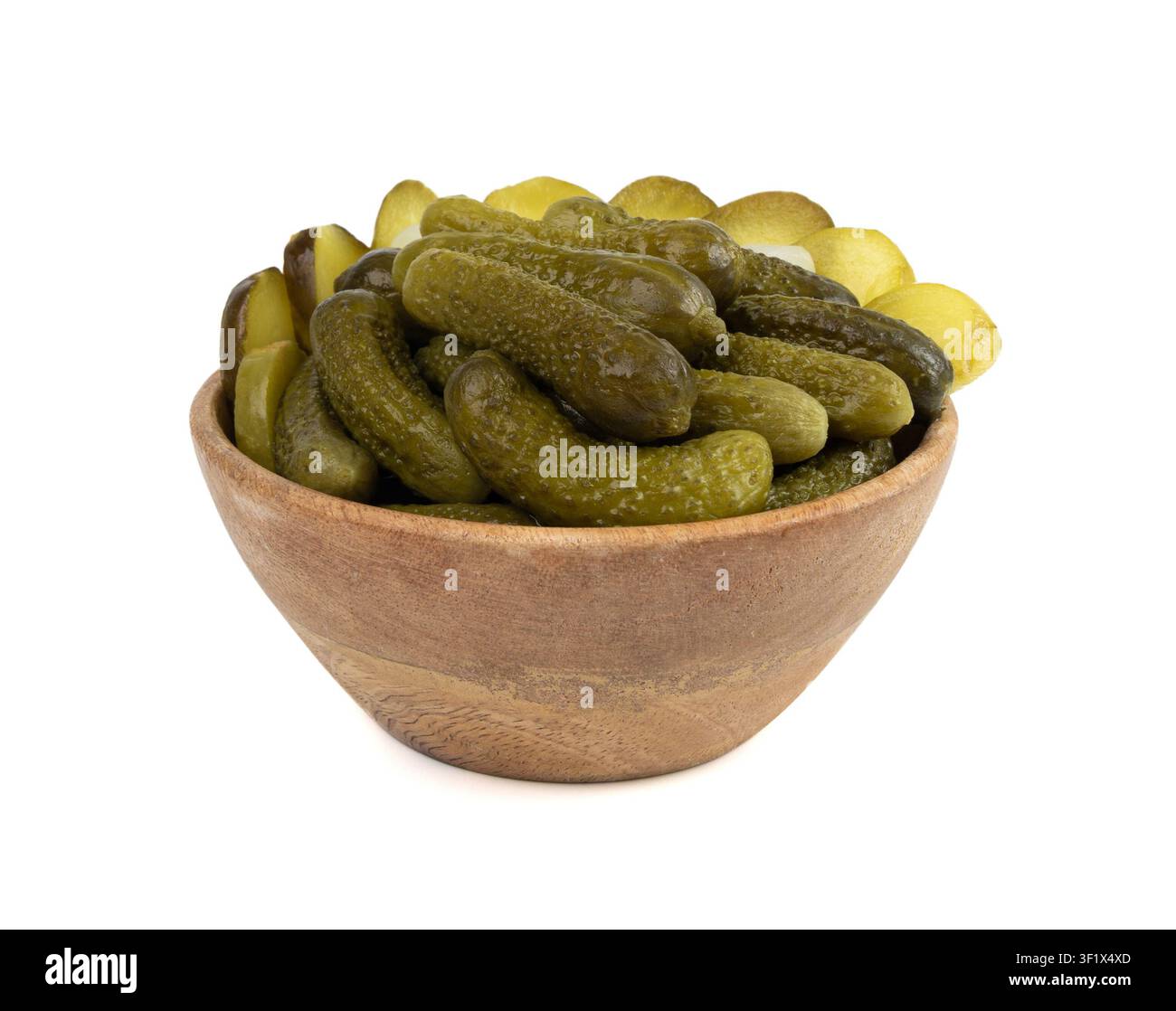 Pickled sliced cucumbers in wood bowl isolated. fermented food, marinated canned vegetables, gherkins, pickled cucumbers on white background Stock Photo