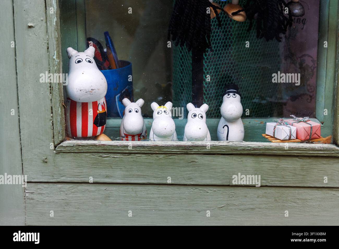 Tallinn, Estonia, August 31, 2024. Moomin character figurines and collectible decorations displayed in a souvenir shop window. Stock Photo