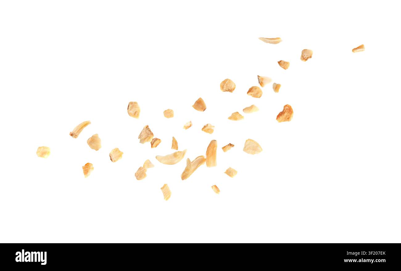 Falling Dry Garlic Slices Isolated, Flying Crispy Fried Cloves Pile Closeup, Roasted Grilled Garlic Flakes, Clove Chip Group on White Background Stock Photo