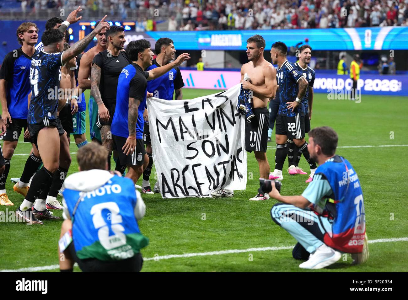 Argentina players hold up a banner with the words 'Las Malvinas son Argentinas' which translates to 'The Malvinas are Argentine' following victory in the FIFA World Cup 2026 semi-final match at the Atlanta Stadium. Picture date: Wednesday July 15, 2026. Stock Photo