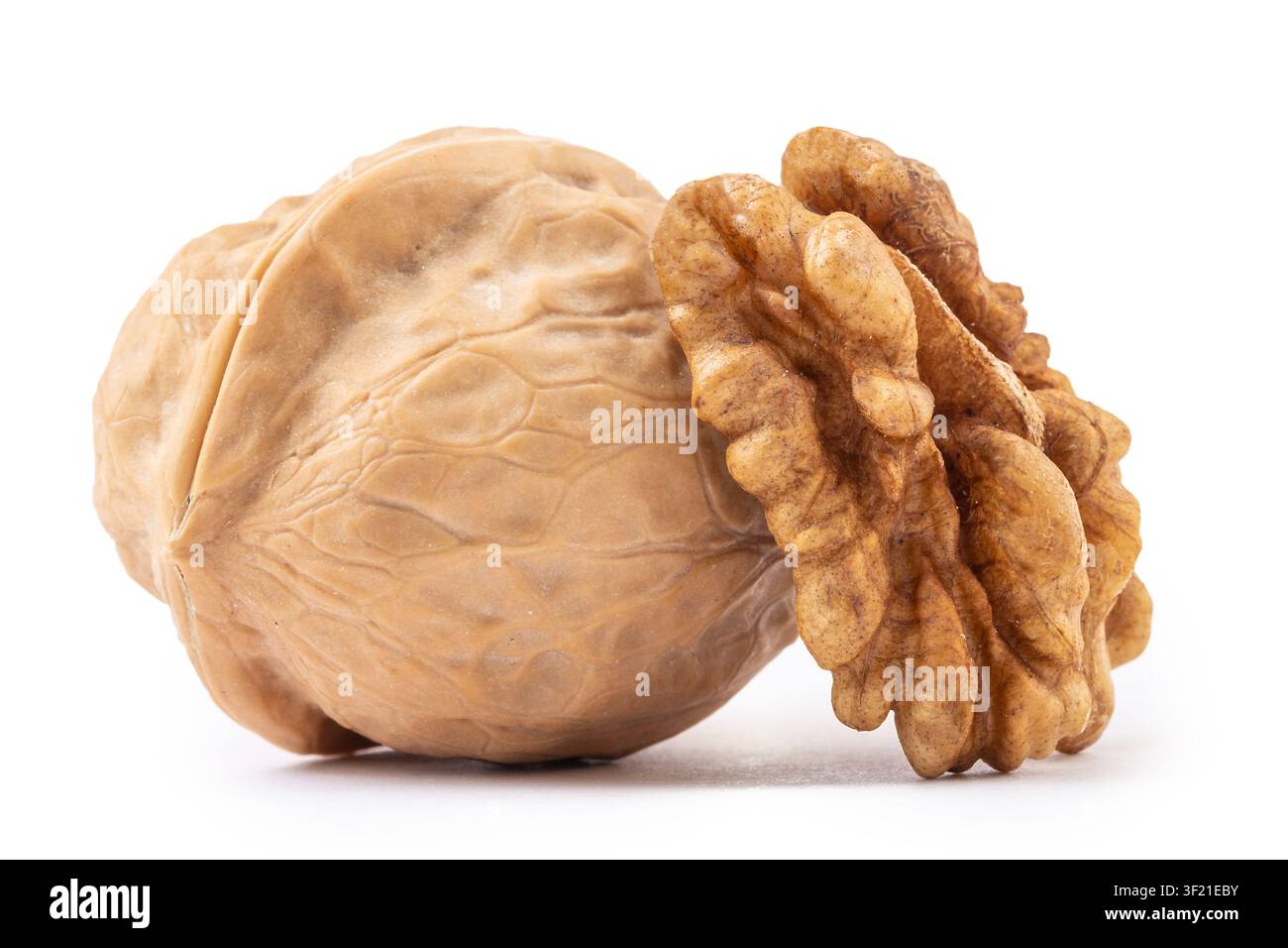 Whole walnuts and cracked walnut kernel isolated on white background Stock Photo