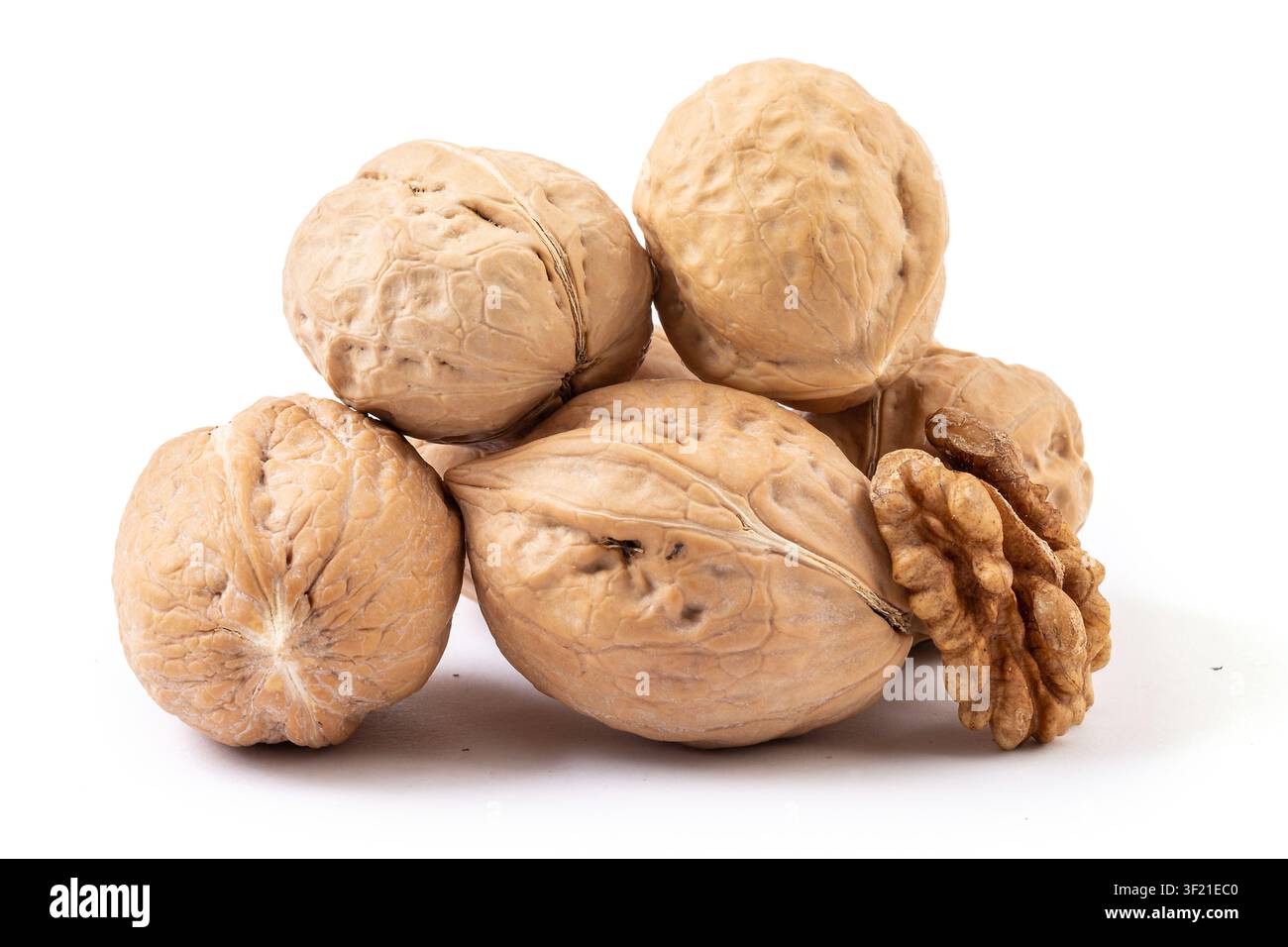 Whole walnuts and cracked walnut kernel isolated on white background Stock Photo