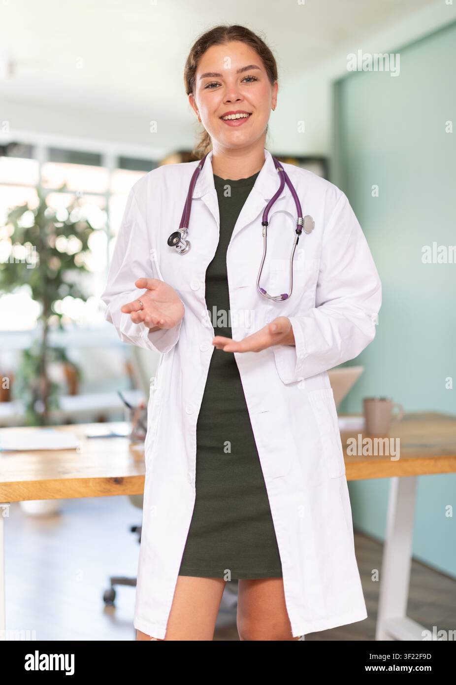 positive-female-doctor-conducts-survey-or-talks-in-the-office-of-modern
