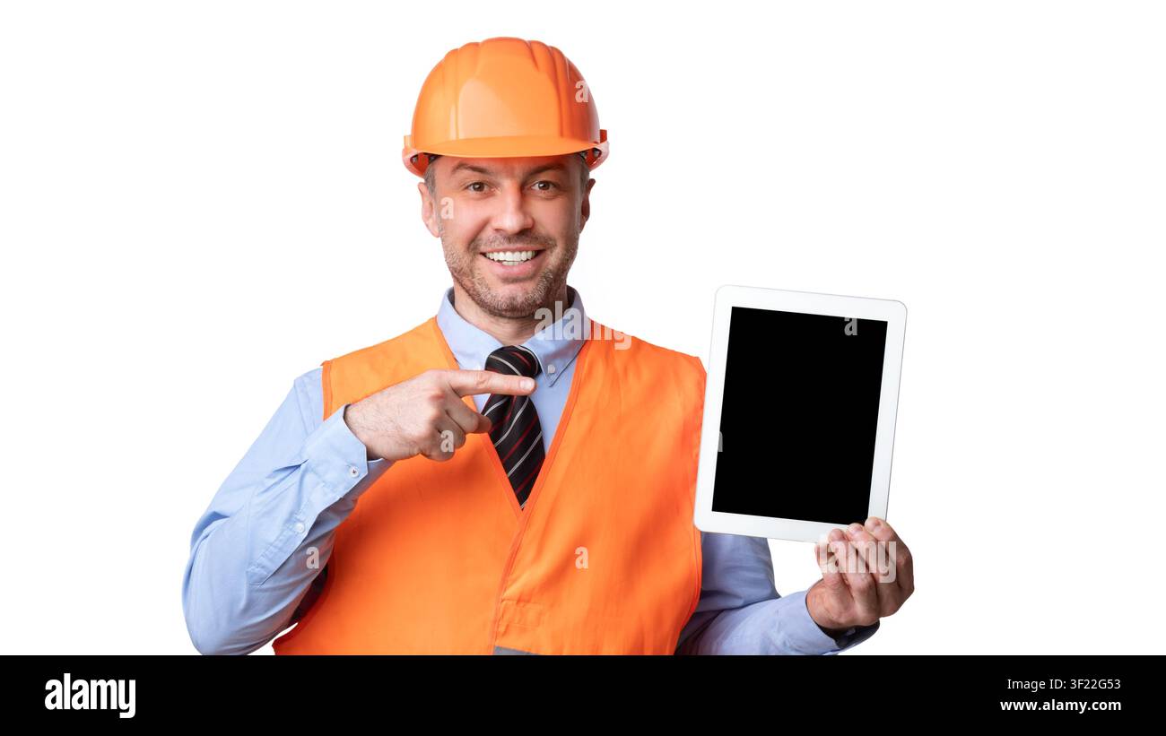 Builder Showing Tablet Pointing Finger At Empty Screen, White Background Stock Photo