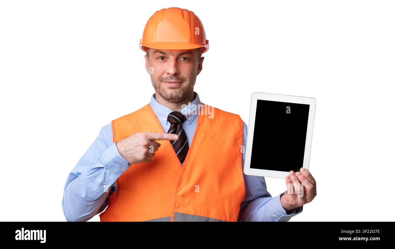 Builder Showing Tablet Computer Pointing Finger At Screen, White Background Stock Photo