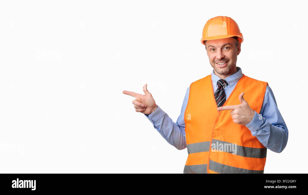 Construction Worker Pointing Fingers Aside Posing On White Background, Panorama Stock Photo