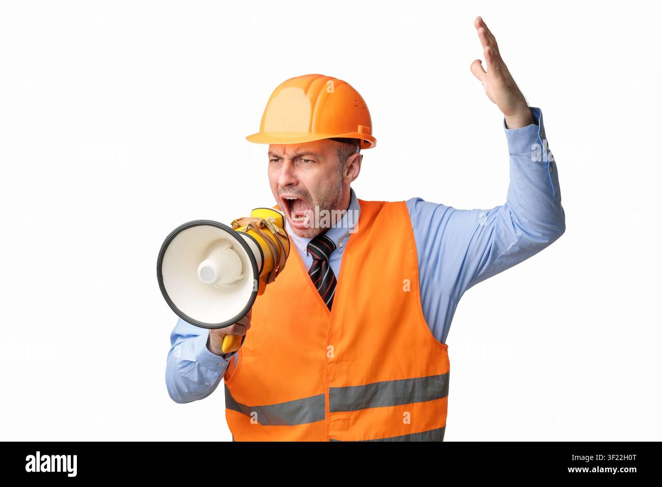 Angry Builder Worker Shouting In Megaphone Standing Over White Background Stock Photo