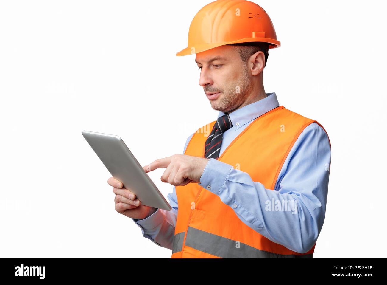 Building Engineer Using Digital Tablet Computer, Studio Shot Stock Photo