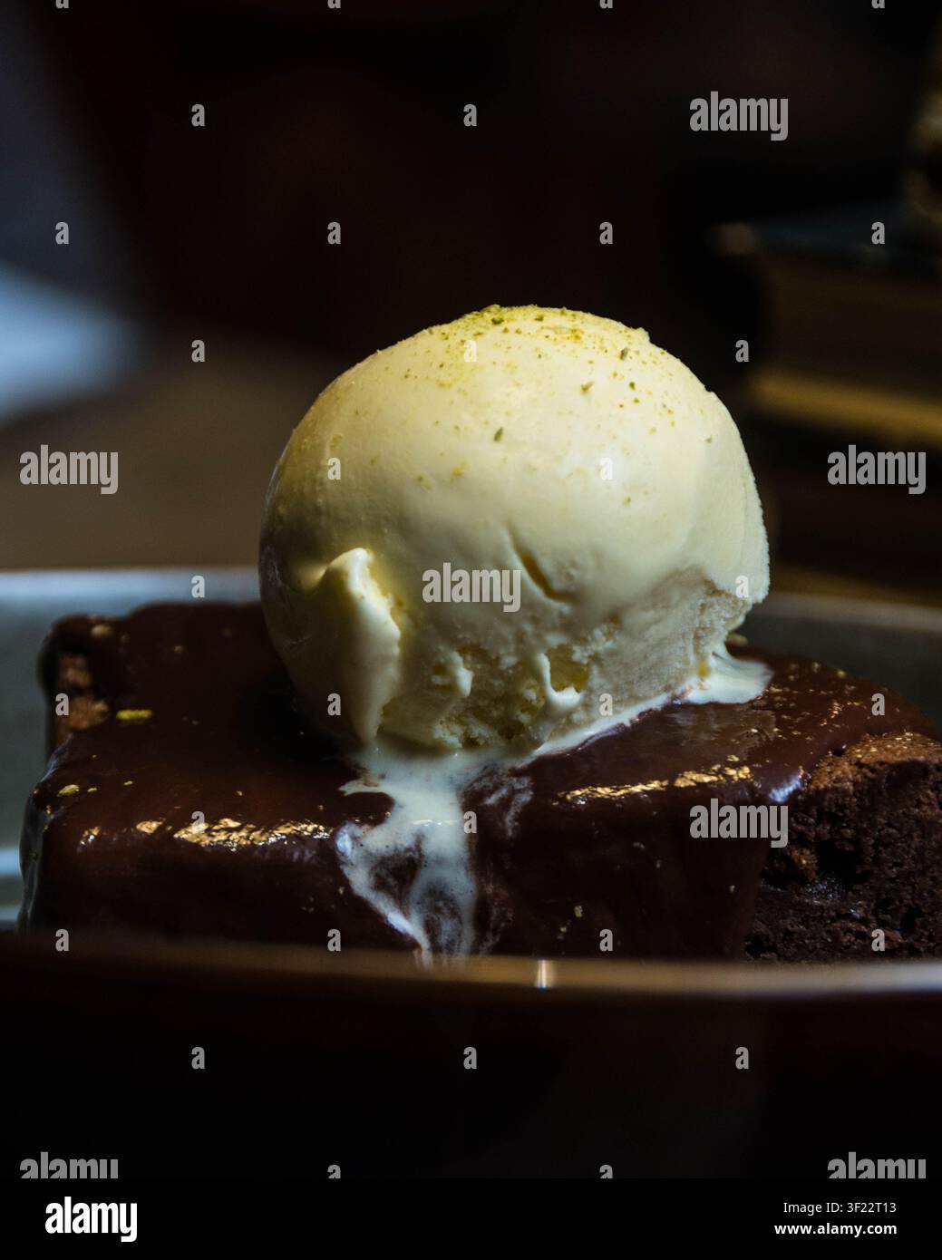 Chocolate Brownie with Vanilla Ice Cream and Rich Chocolate Sauce Stock Photo