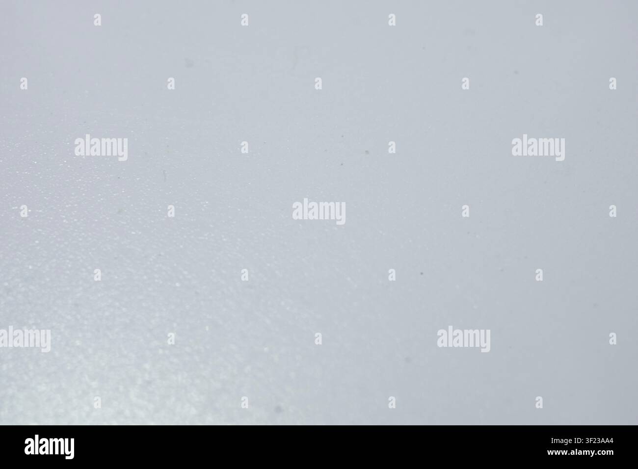 Blank light grey material showing subtle grain and details under soft studio lighting Stock Photo