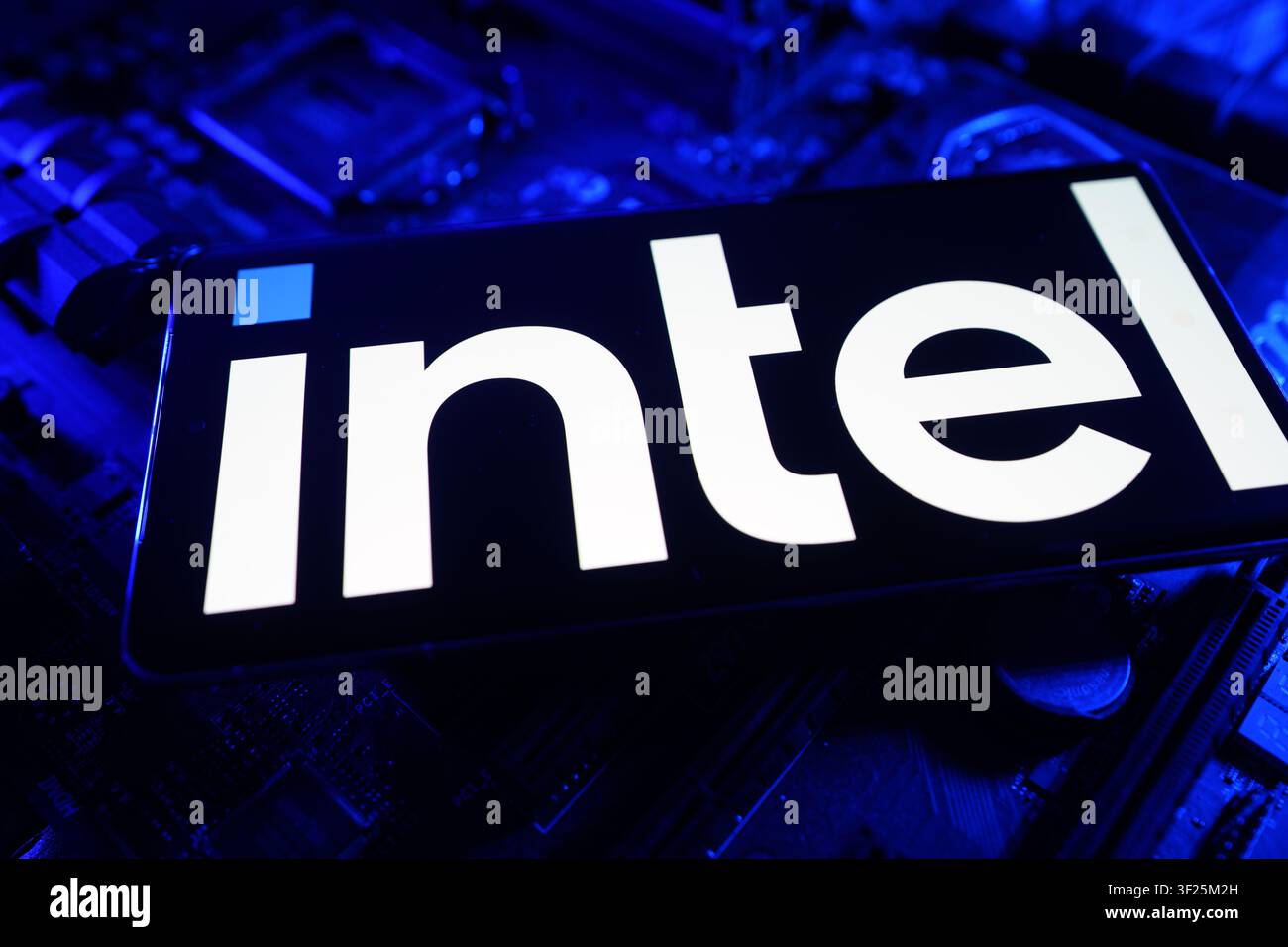 Intel Logo Displayed on Computer Chip Circuit Board CPU Motherboard Representing Semiconductor Processing and Computer Technology Innovation Stock Photo