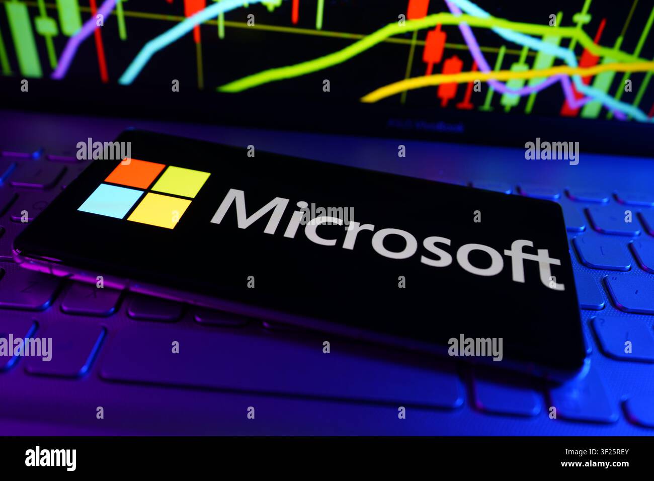 Microsoft Technology Company Developing Software Cloud Computing and Artificial Intelligence Solutions Logo on Smartphone With Stock Market Performanc Stock Photo