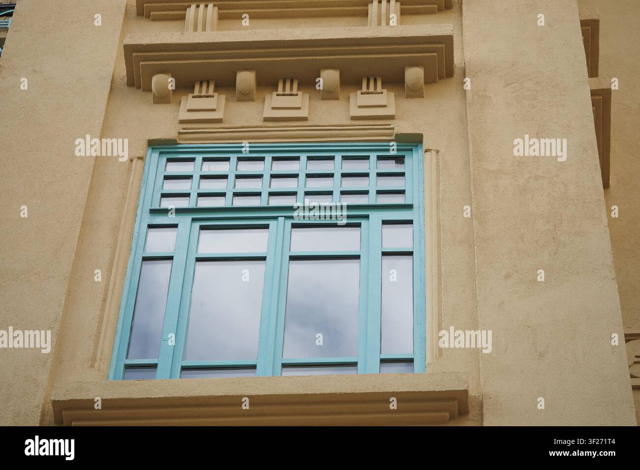 Window design on a building with light blue frames Stock Photo