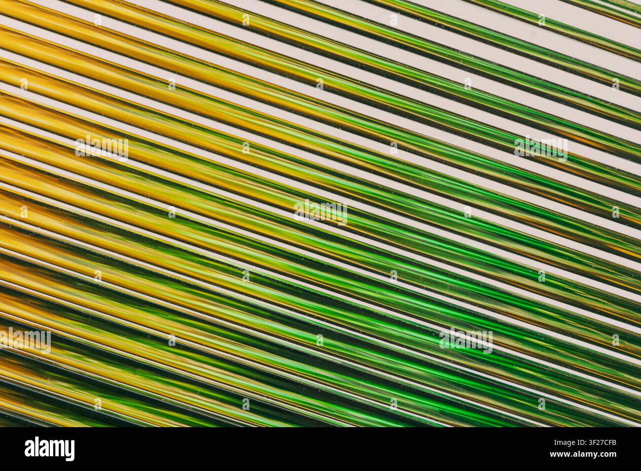 Abstract diagonal lines creating green and gold pattern Stock Photo