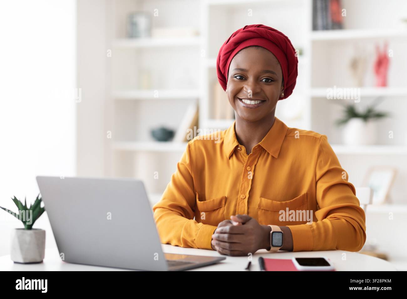 Smiling Young Black Woman Working On Laptop In Home Office, Business Concept Stock Photo