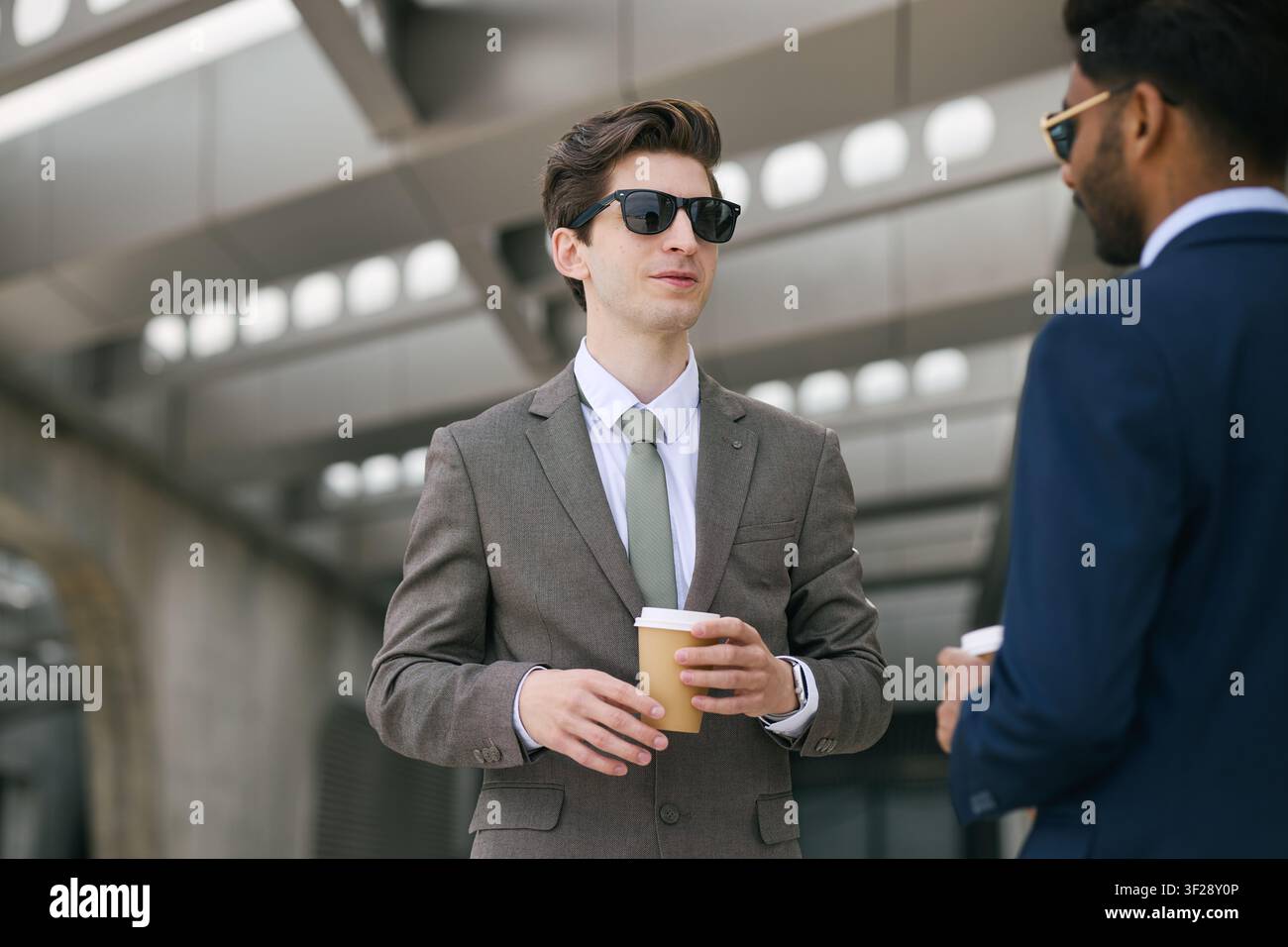 Businessmen Networking over Coffee during Break Stock Photo
