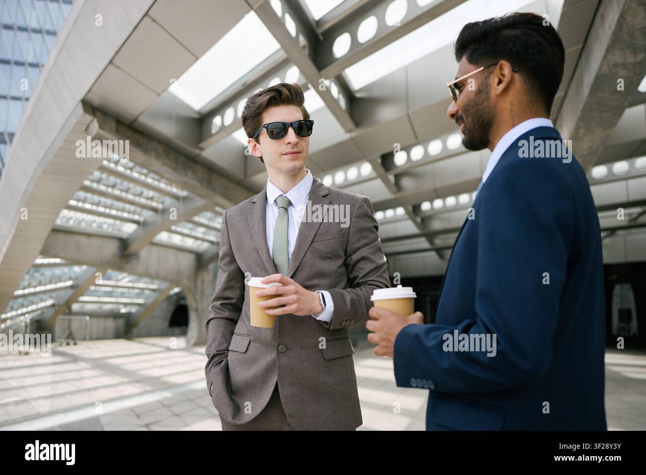 Diverse Businessmen Networking over Coffee Outdoors Stock Photo