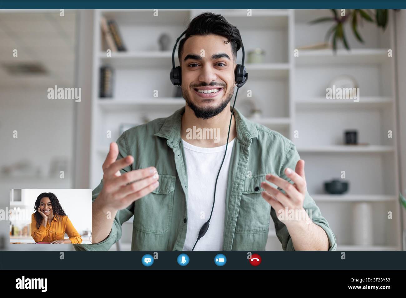 Smiling Young Arab Man In Headset Communicating Online, Remote Work Concept Stock Photo
