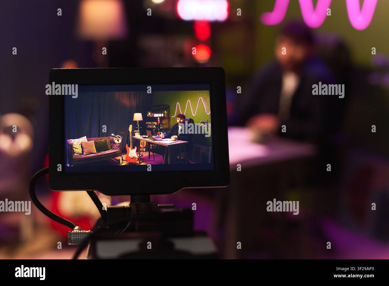 Man Recording Video Content in Studio for Online Broadcasting Stock Photo