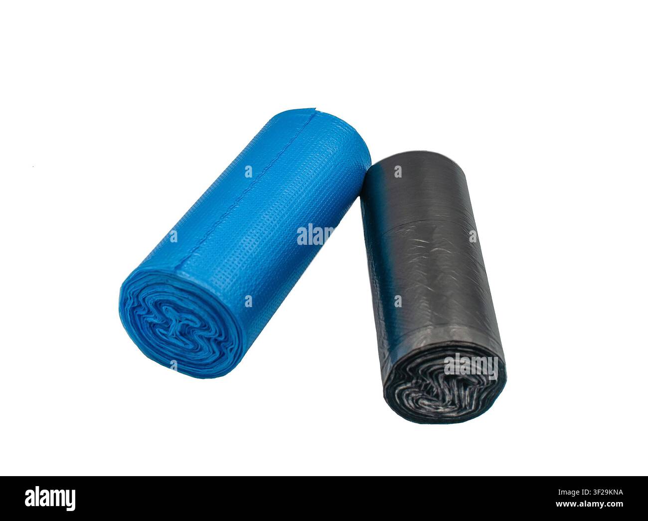 Blue and black trash bag rolls on white background Stock Photo