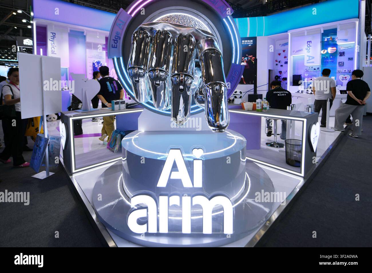 People visit the booth of ARM during the World AI Conference in ...