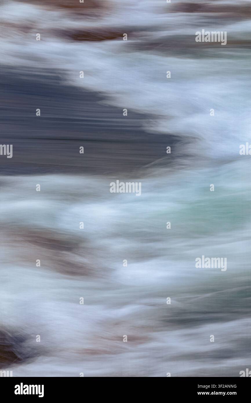 water in motion creates an interesting background, blurred with camera motion. Stock Photo