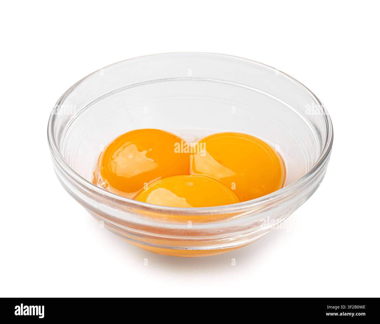 Egg Yolks in Bowl, 3 Fresh Chicken Egg Yolk Separated from Whites for Cooking Recipe, Three Organic Yolks in Glass Bowl Stock Photo