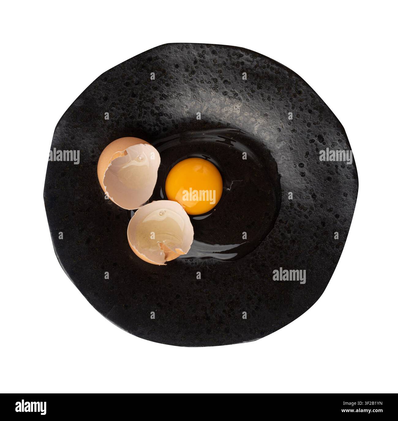 One Broken Egg in Black Bowl, Raw Yolk and White, Fresh Broken Organic Chicken Egg on Wooden Rustic Background Stock Photo