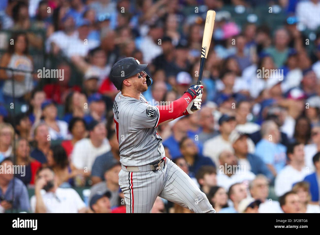Ryan Jeffers watching his home run during a game against the Chicago Cubs