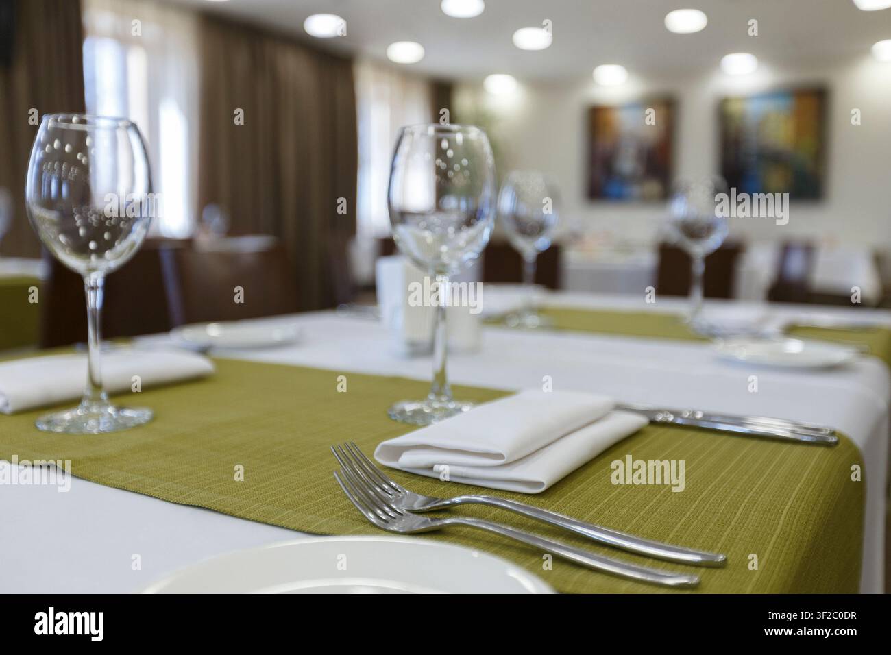Focus on wine glasses on table in restaurant Stock Photo