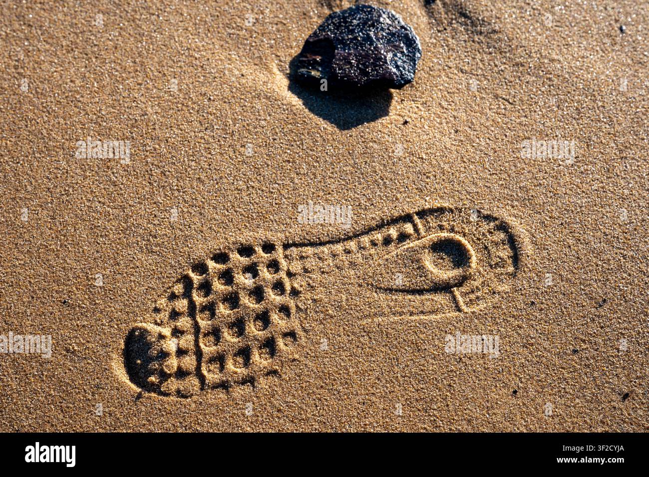 Shoe prints in the sand Stock Photo