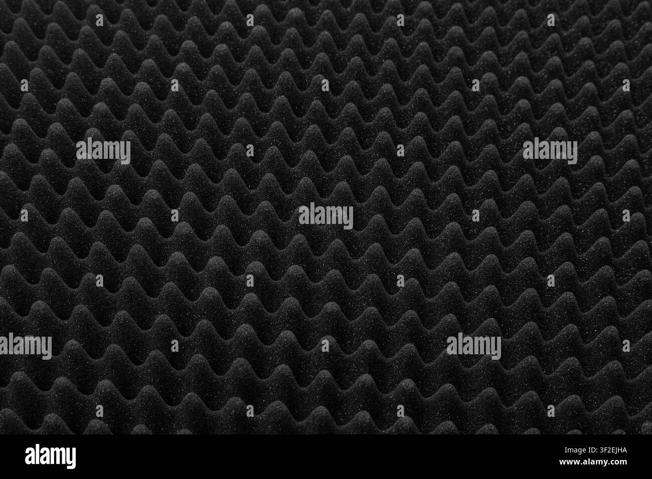 Black acoustic foam texture pattern for soundproofing background. Stock Photo