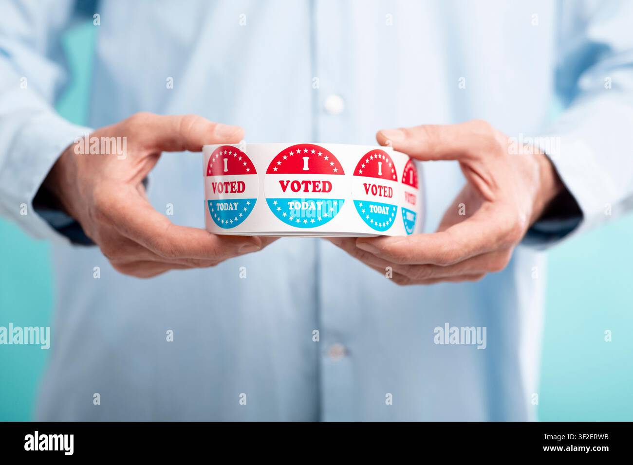 Man holding I voted today stickers roll Stock Photo
