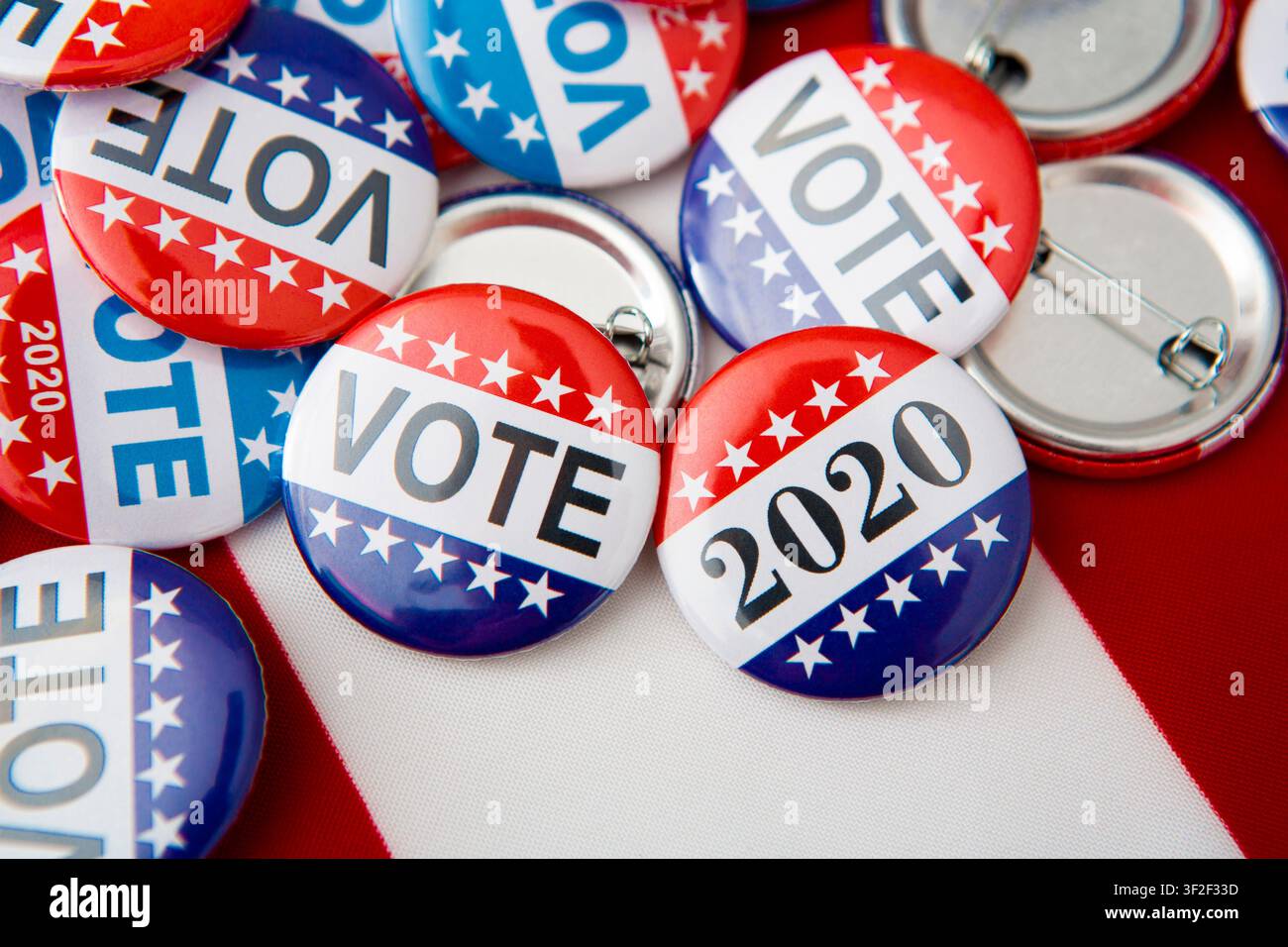 Red, white, and blue vote buttons on background Stock Photo