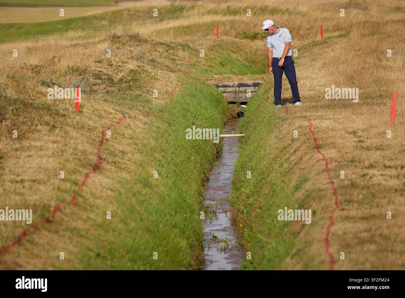 lucas-herbert-of-australia-looks-at-his-ball-on-the-11th-hole-during