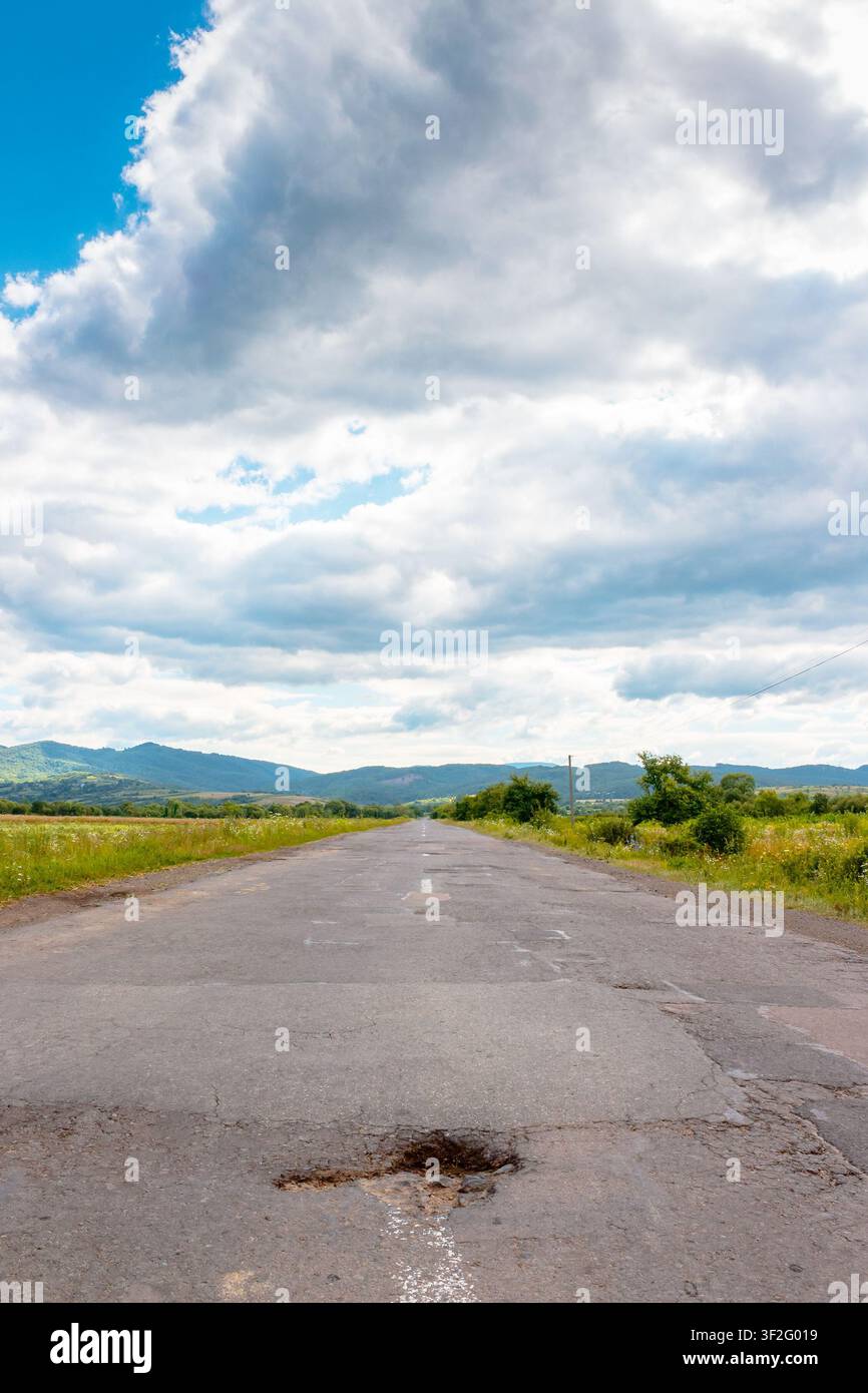 countryside road through carpathian mountains. beautiful summer landscape for ukraine travel background Stock Photo