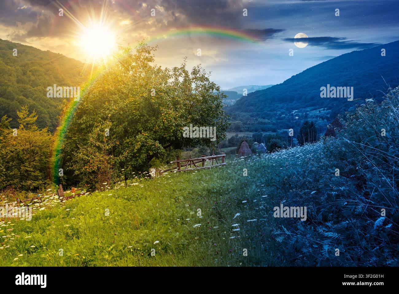 rural mountain landscape of ukraine at twilight. countryside scenery of transcarpathia in summer. night meet day concept. forested hills and grassy me Stock Photo