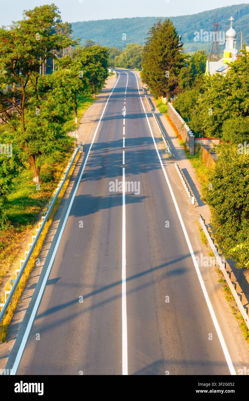 countryside road through carpathian mountains. beautiful summer landscape for ukraine travel background Stock Photo