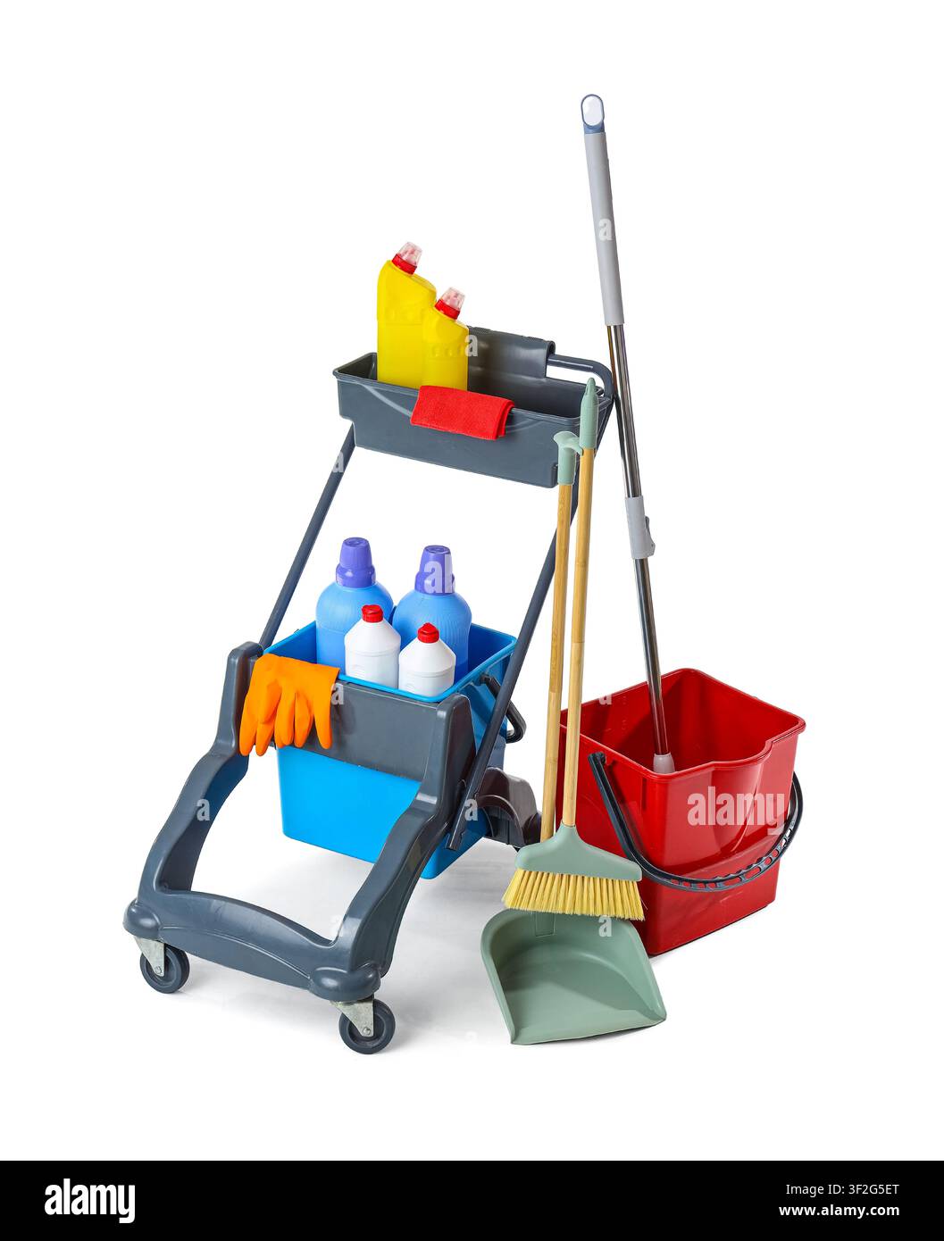 Professional cleaning cart with various supplies including detergents mop broom and bucket isolated on a white background Stock Photo