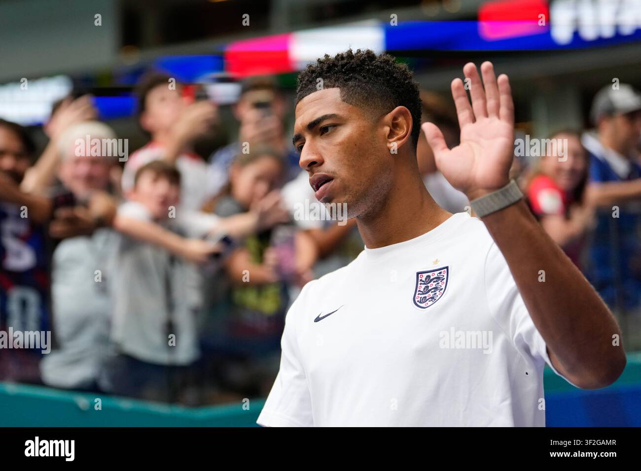 england-s-jude-bellingham-waves-to-fans-as-he-walks-onto-the-pitch