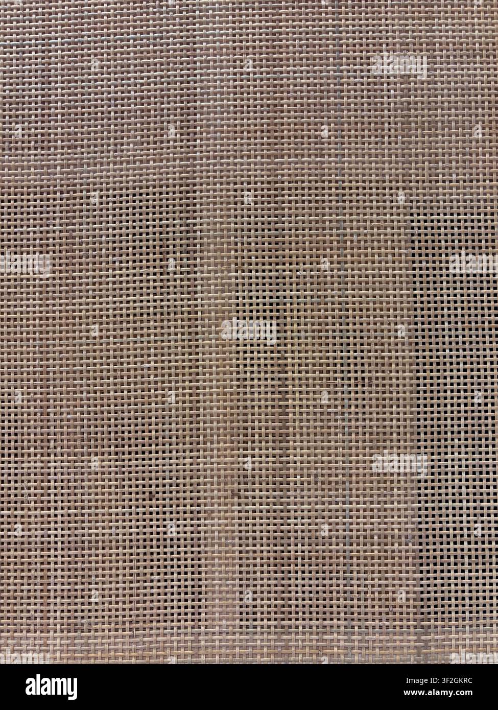 Woven cane webbing texture in warm natural beige for furniture and interior backgrounds Stock Photo